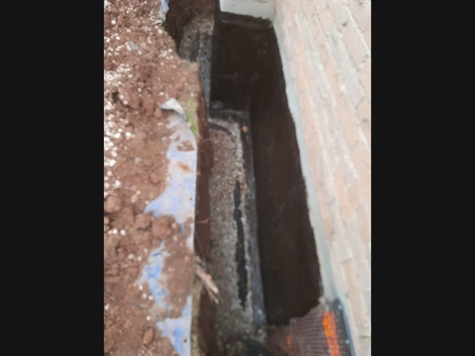 Exterior foundation membrane on a Hawkestone-area job