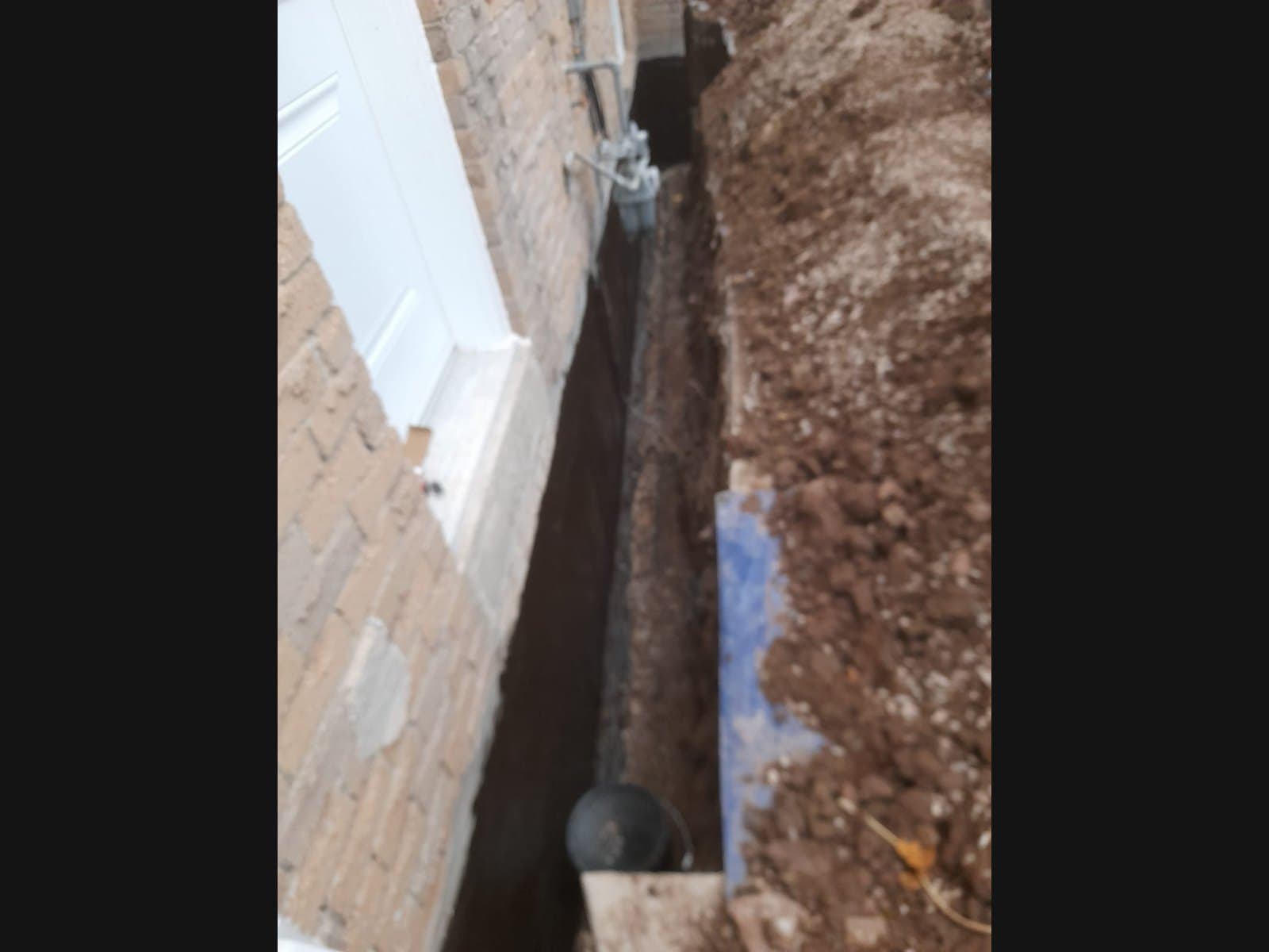 Interior corner drain installation on an Atherley-area foundation